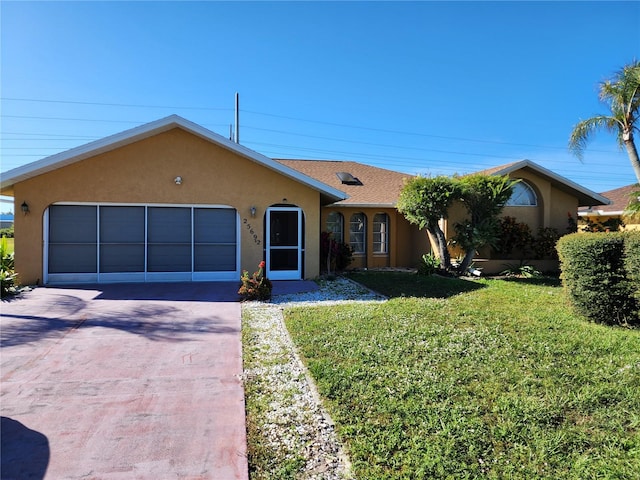 ranch-style house with a front yard and a garage