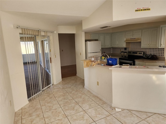 kitchen with backsplash, custom range hood, light tile patterned floors, electric range, and white fridge