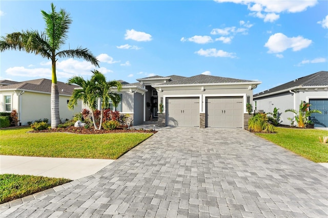 view of front facade featuring a front yard and a garage