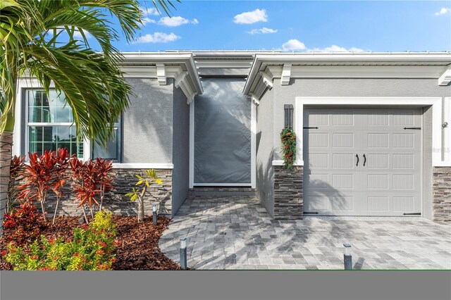 doorway to property featuring a garage