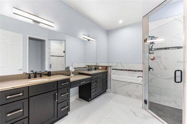 bathroom featuring separate shower and tub and vanity