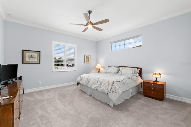 carpeted bedroom featuring ceiling fan and ornamental molding