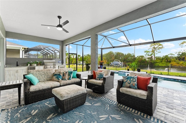 view of patio with outdoor lounge area, area for grilling, a fenced in pool, and sink