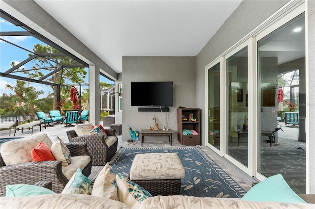 exterior space featuring an outdoor hangout area and glass enclosure