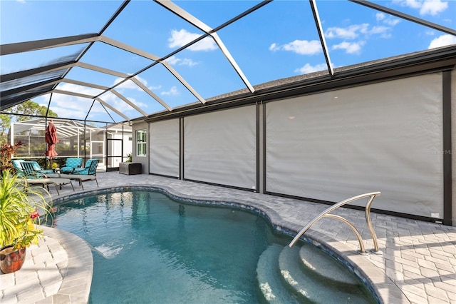 view of pool featuring a lanai and a patio