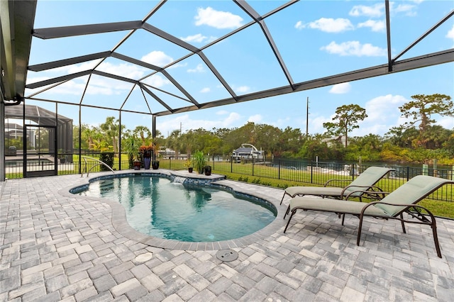 view of pool featuring a patio, a lanai, and a lawn