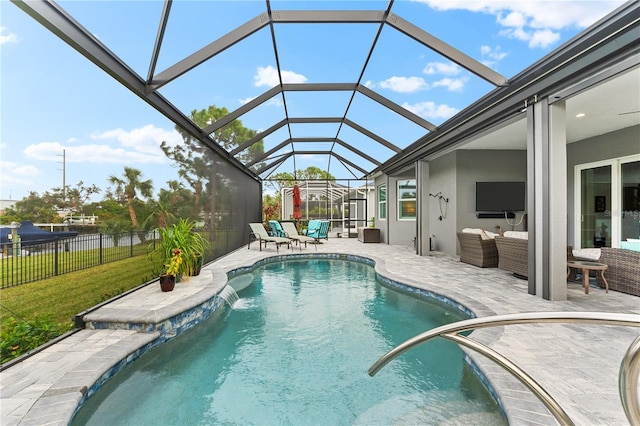 view of pool with a lawn, a lanai, an outdoor hangout area, pool water feature, and a patio area