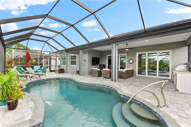 view of swimming pool with an outdoor hangout area, a lanai, a patio area, and ceiling fan