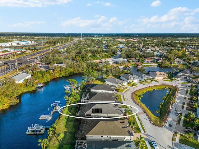 bird's eye view with a water view