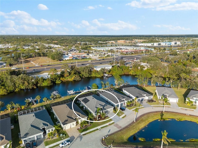 birds eye view of property with a water view