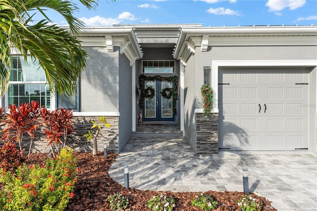 view of exterior entry featuring a garage