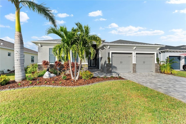 view of front of house with a garage and a front yard