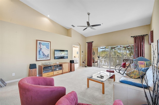 living room featuring ceiling fan, carpet floors, and high vaulted ceiling