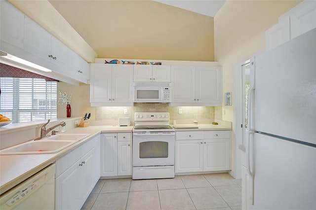 kitchen with white cabinetry, sink, and white appliances