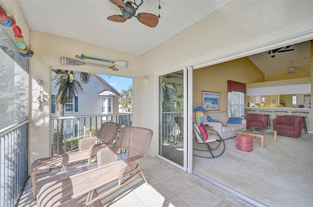 sunroom featuring vaulted ceiling