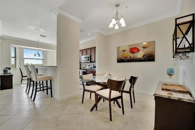 dining room with a chandelier, light tile patterned floors, and ornamental molding