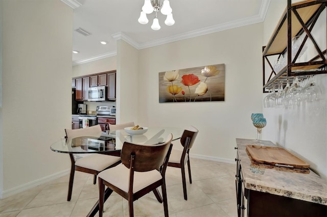 dining space with an inviting chandelier, ornamental molding, and light tile patterned flooring