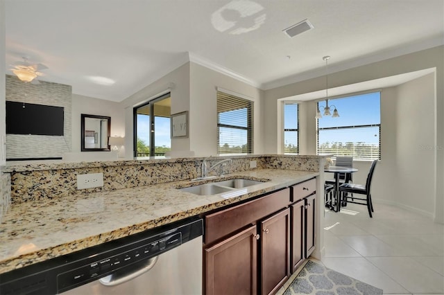 kitchen with pendant lighting, dishwasher, crown molding, sink, and light stone counters