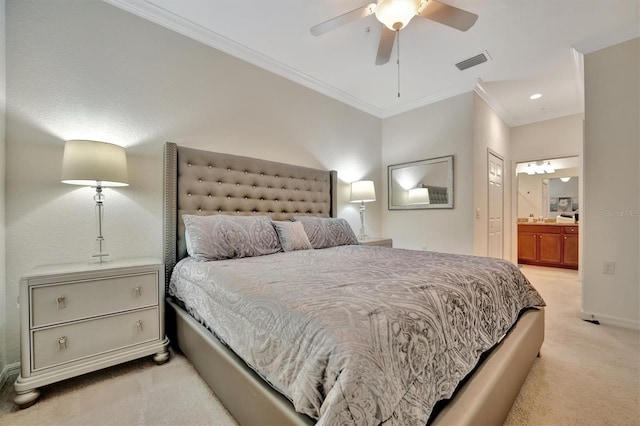 carpeted bedroom featuring ensuite bathroom, ceiling fan, and crown molding