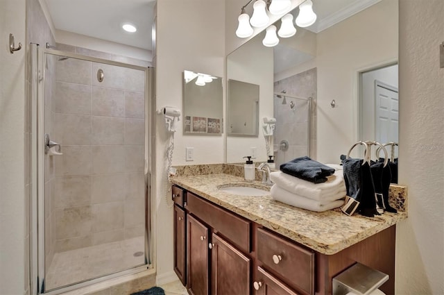 bathroom with vanity and a shower with shower door