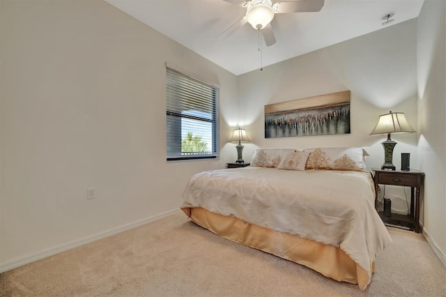 bedroom with ceiling fan and light colored carpet