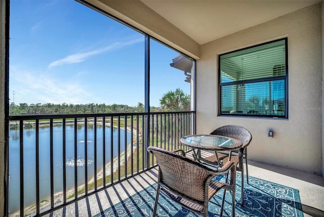 sunroom / solarium with a water view