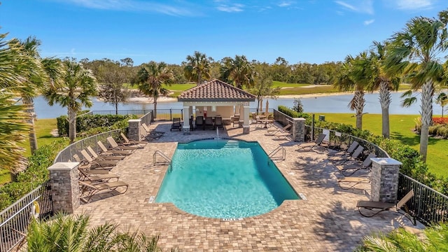 view of pool with a gazebo, a water view, and a patio