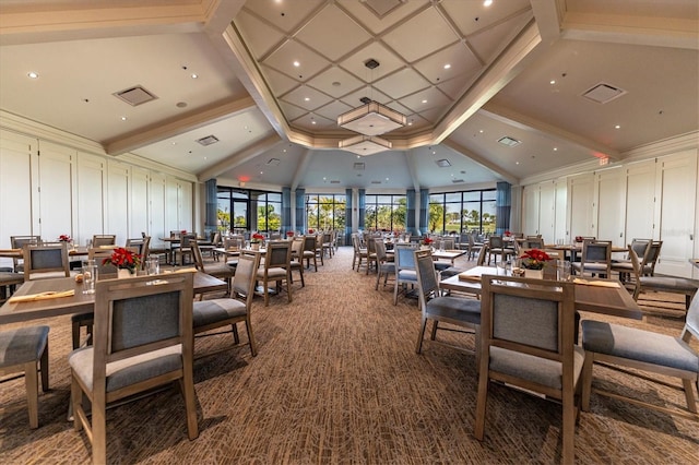 carpeted dining room with high vaulted ceiling