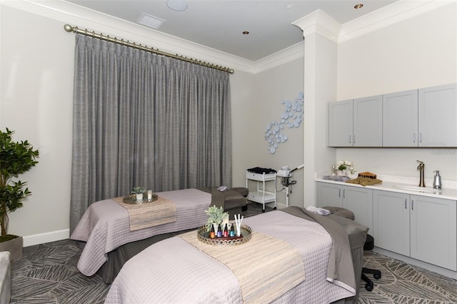 bedroom with ornamental molding and sink