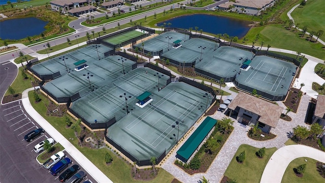 birds eye view of property with a water view