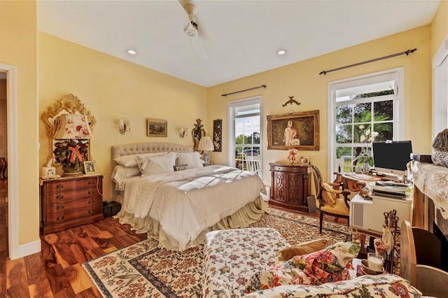 bedroom featuring ceiling fan and dark wood-type flooring