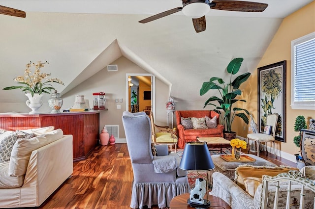 living area featuring ceiling fan, dark hardwood / wood-style flooring, and lofted ceiling