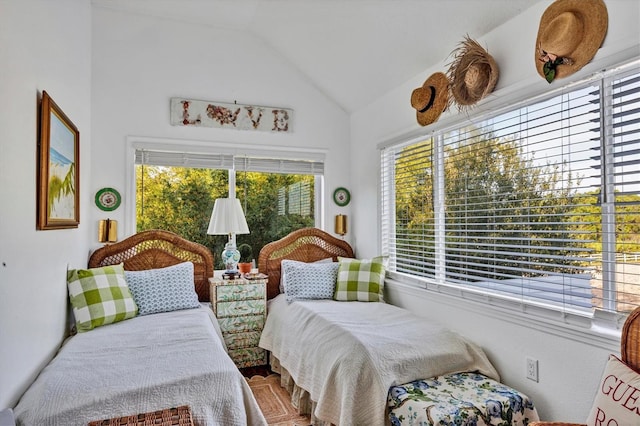 sunroom featuring vaulted ceiling