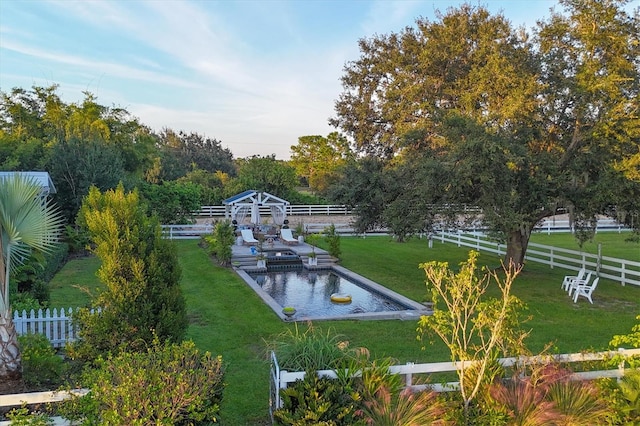 surrounding community featuring a lawn