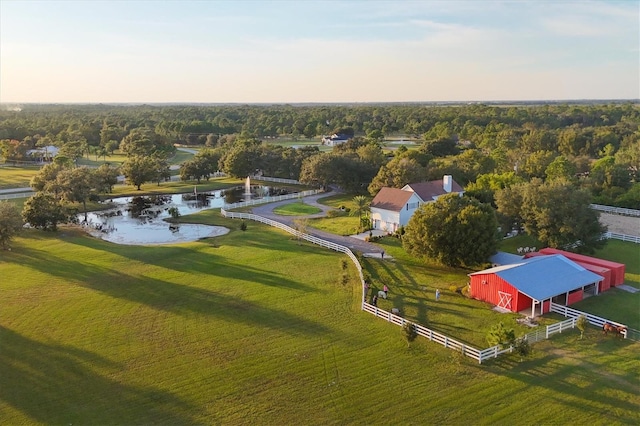 birds eye view of property featuring a rural view and a water view