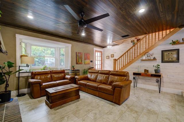 living room with wood walls, ceiling fan, and wood ceiling