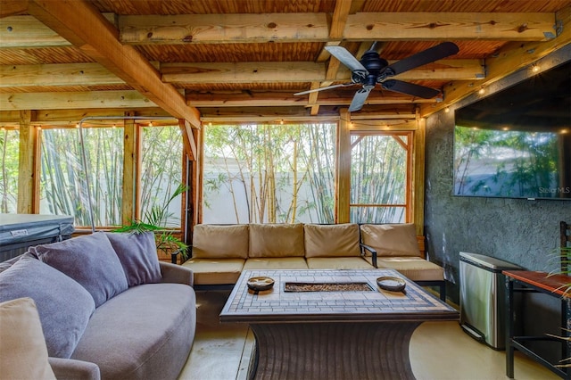 sunroom / solarium with ceiling fan, beamed ceiling, and wooden ceiling