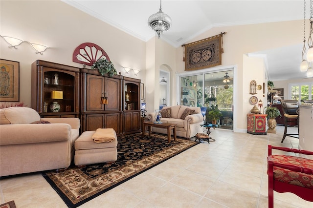 tiled living room with lofted ceiling, crown molding, and an inviting chandelier