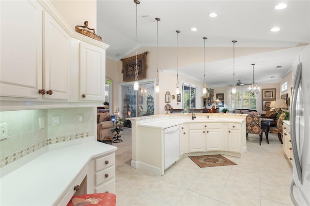 kitchen with stainless steel refrigerator, white cabinetry, white dishwasher, pendant lighting, and vaulted ceiling