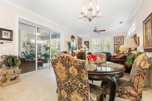 tiled dining area featuring ceiling fan with notable chandelier and crown molding