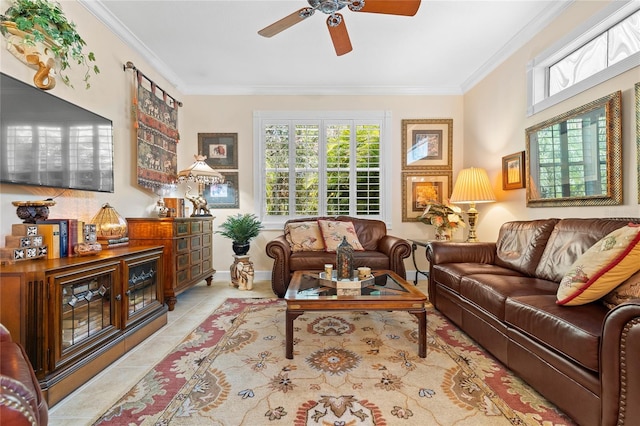 living room with ceiling fan, ornamental molding, and light tile patterned floors