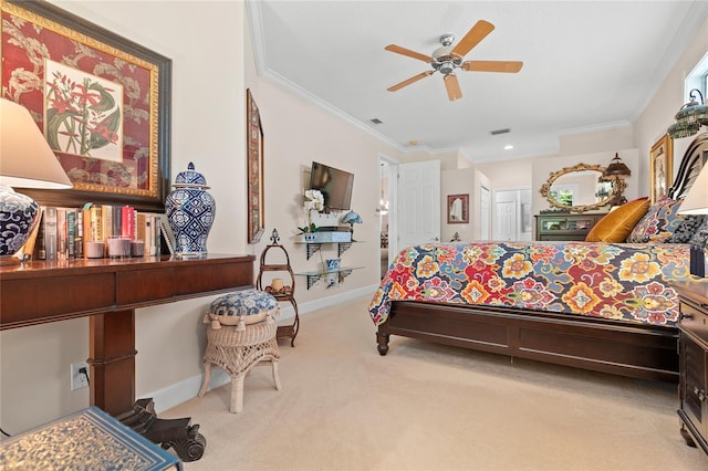 bedroom featuring ceiling fan, light colored carpet, ornamental molding, and a closet