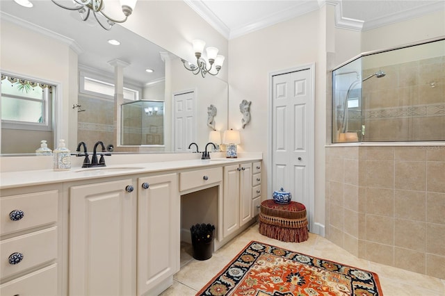 bathroom featuring vanity, an inviting chandelier, crown molding, tile patterned flooring, and an enclosed shower