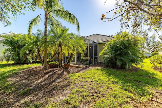 view of yard with a lanai