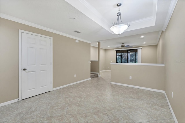 spare room with ceiling fan, ornamental molding, and light tile patterned flooring