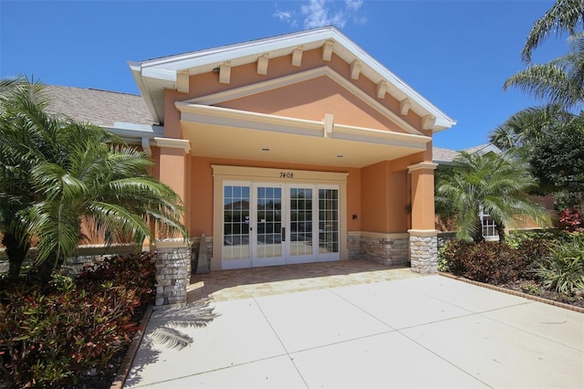 rear view of property featuring french doors