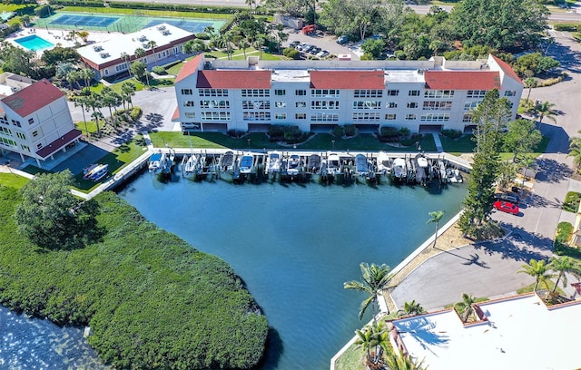 birds eye view of property with a water view