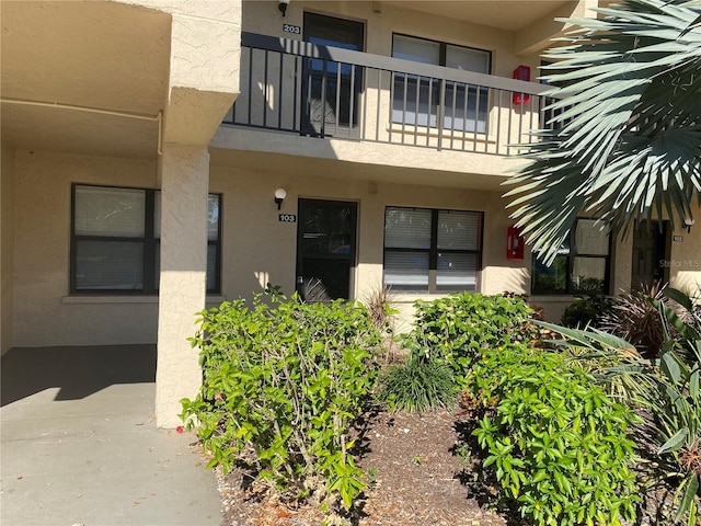 doorway to property featuring a balcony