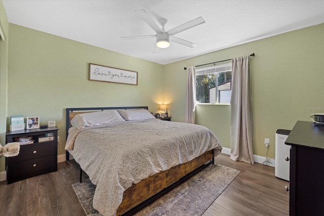 bedroom featuring hardwood / wood-style flooring and ceiling fan