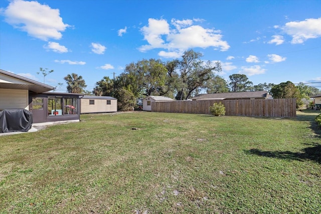 view of yard with an outdoor structure